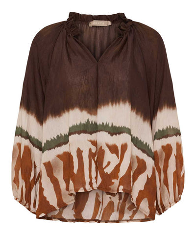 Brun blus med mönster