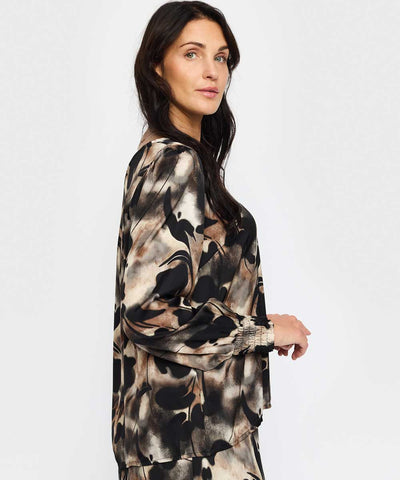 Svart mönstrad blus från sidan