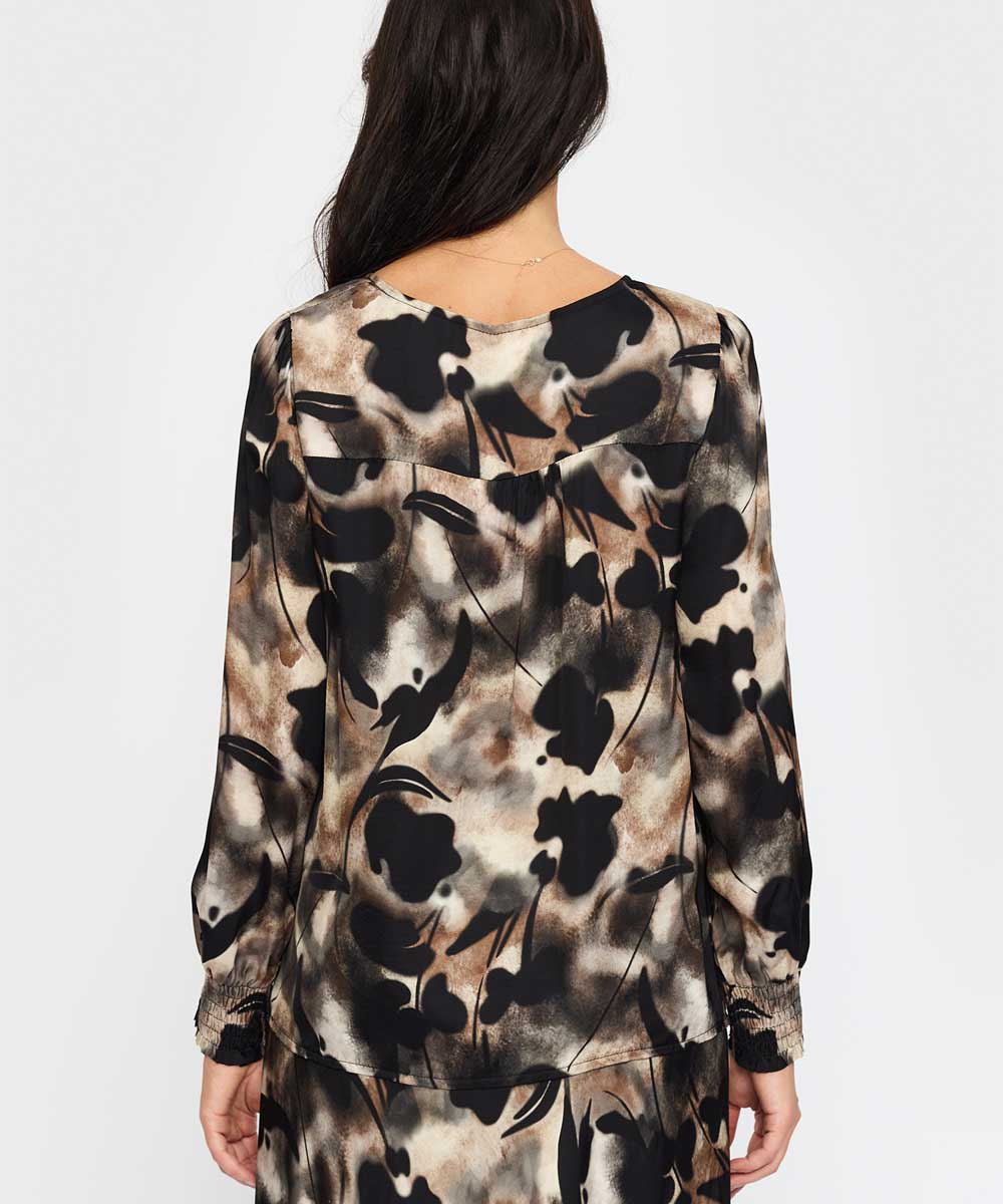 Svart mönstrad blus baksida