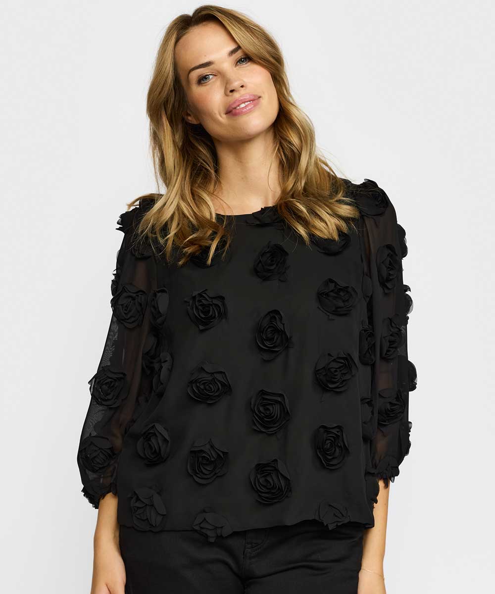 Svart blus med blommor