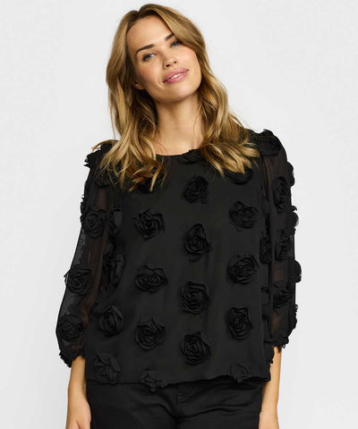 Svart blus med blommor