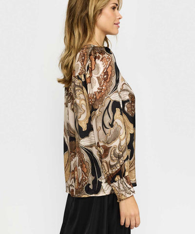 Guldig blus från sidan