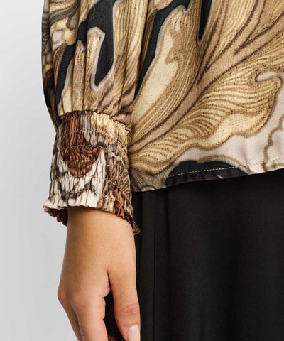 Guldig blus detaljer