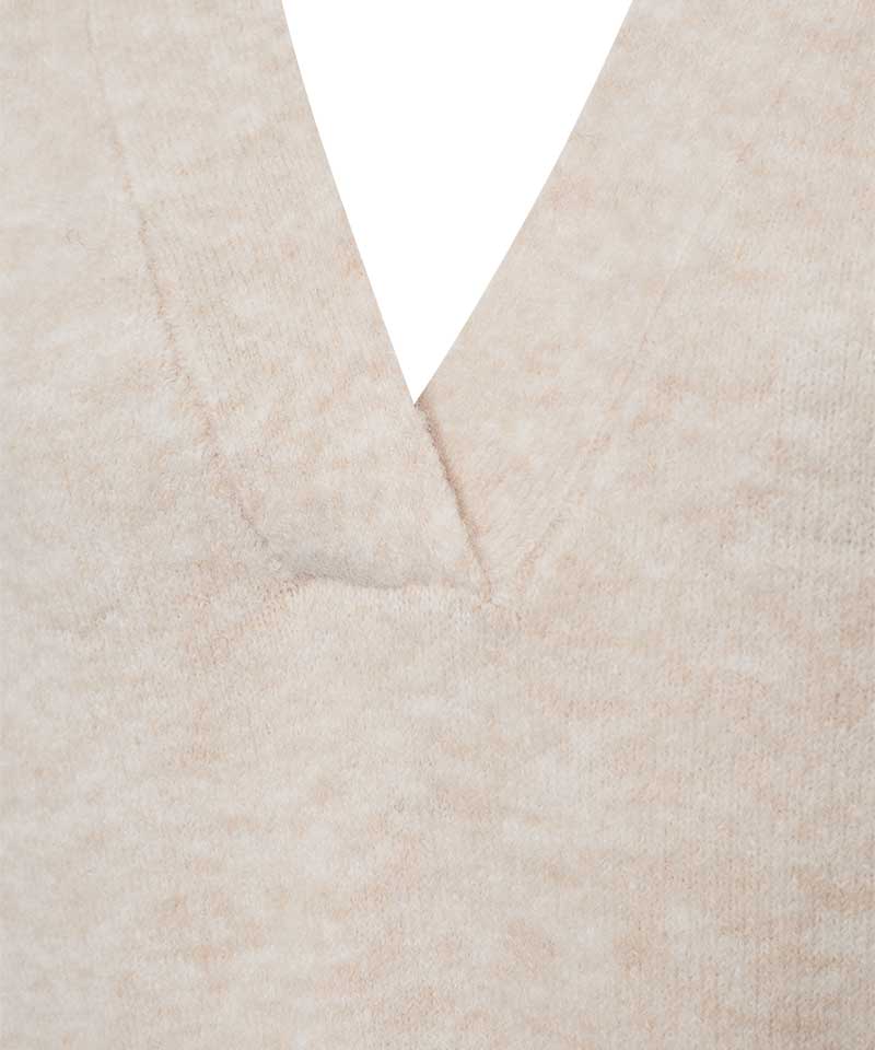 beige tröja detaljer