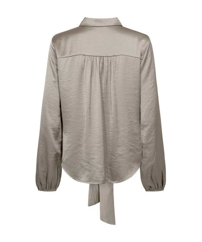 brun blus baksida