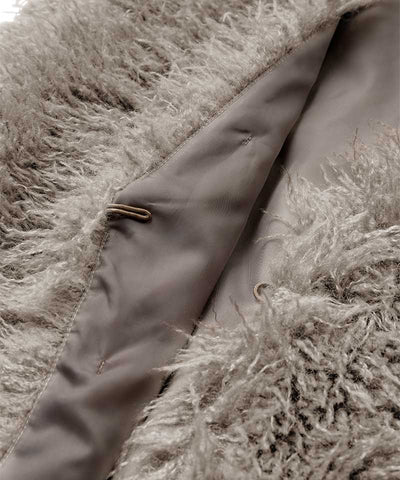 detaljer brun väst