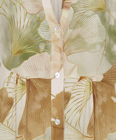 detaljer beige klänning
