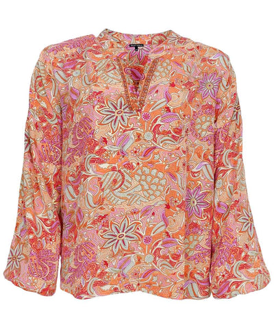 Blus med orange mönster