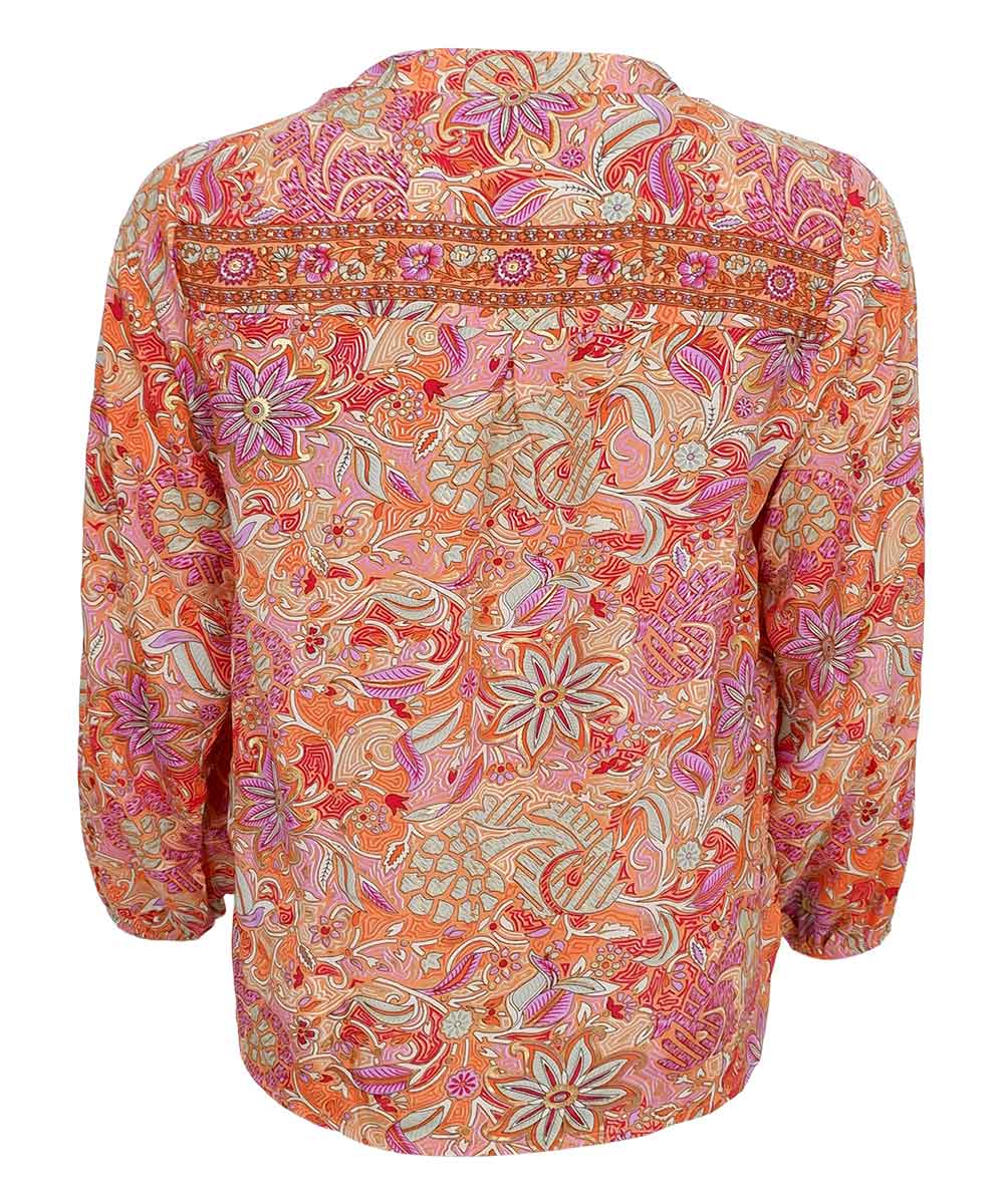 Blus med orange mönster baksida