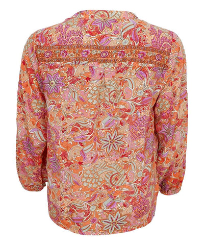Blus med orange mönster baksida