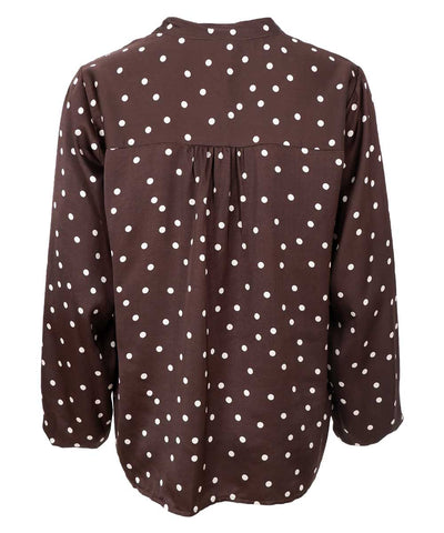 brun blus med prickar baksida