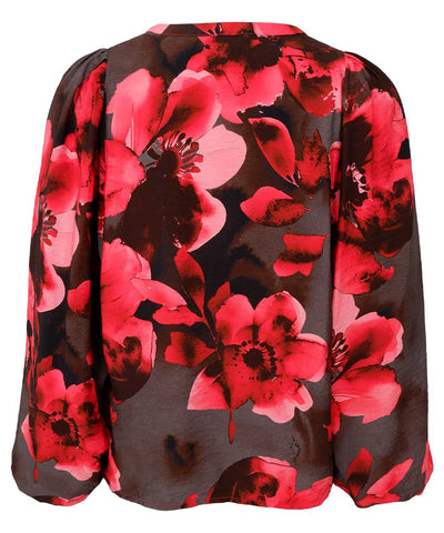 blus med rött mönster baksida