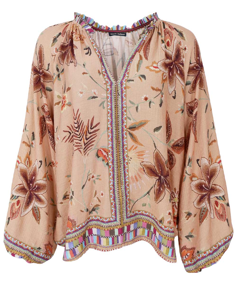 beige blus med blommor