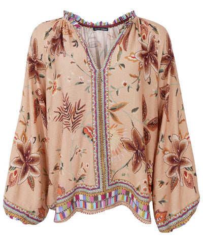 beige blus med blommor