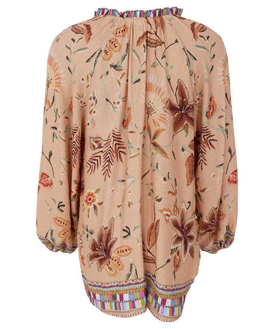 beige blus baksida