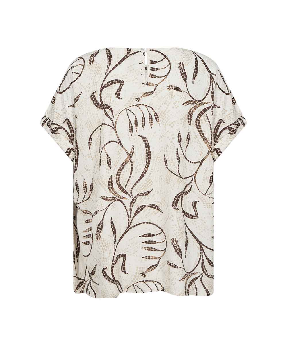 Blus med mosaikmönster bak