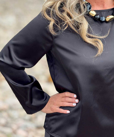 detaljer svart blus