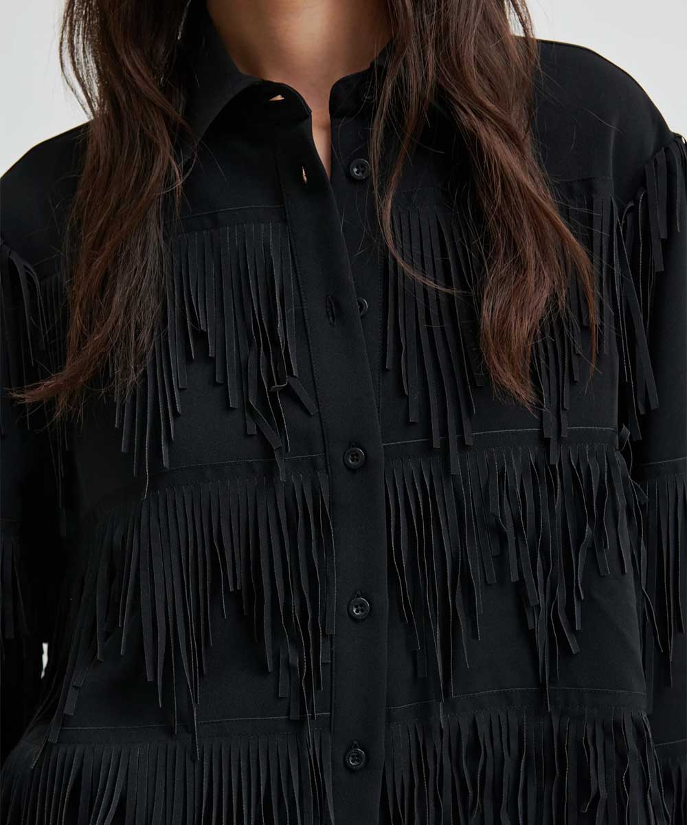 detaljer blus med fransar