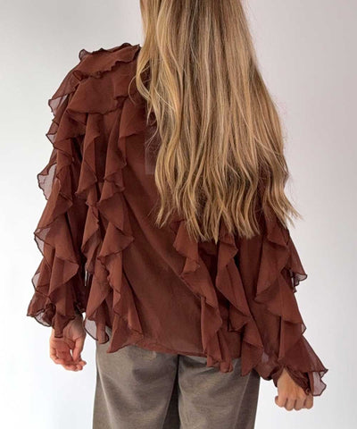 brun blus baksida