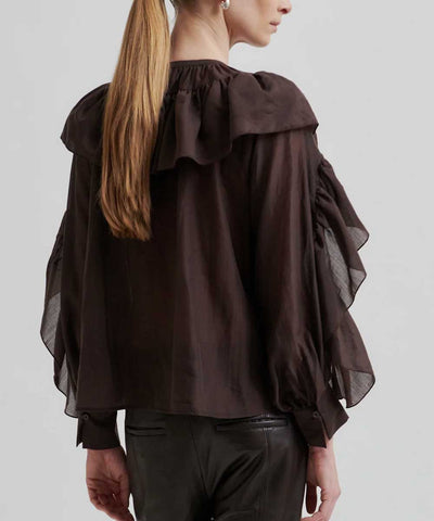 blus med volang baksida