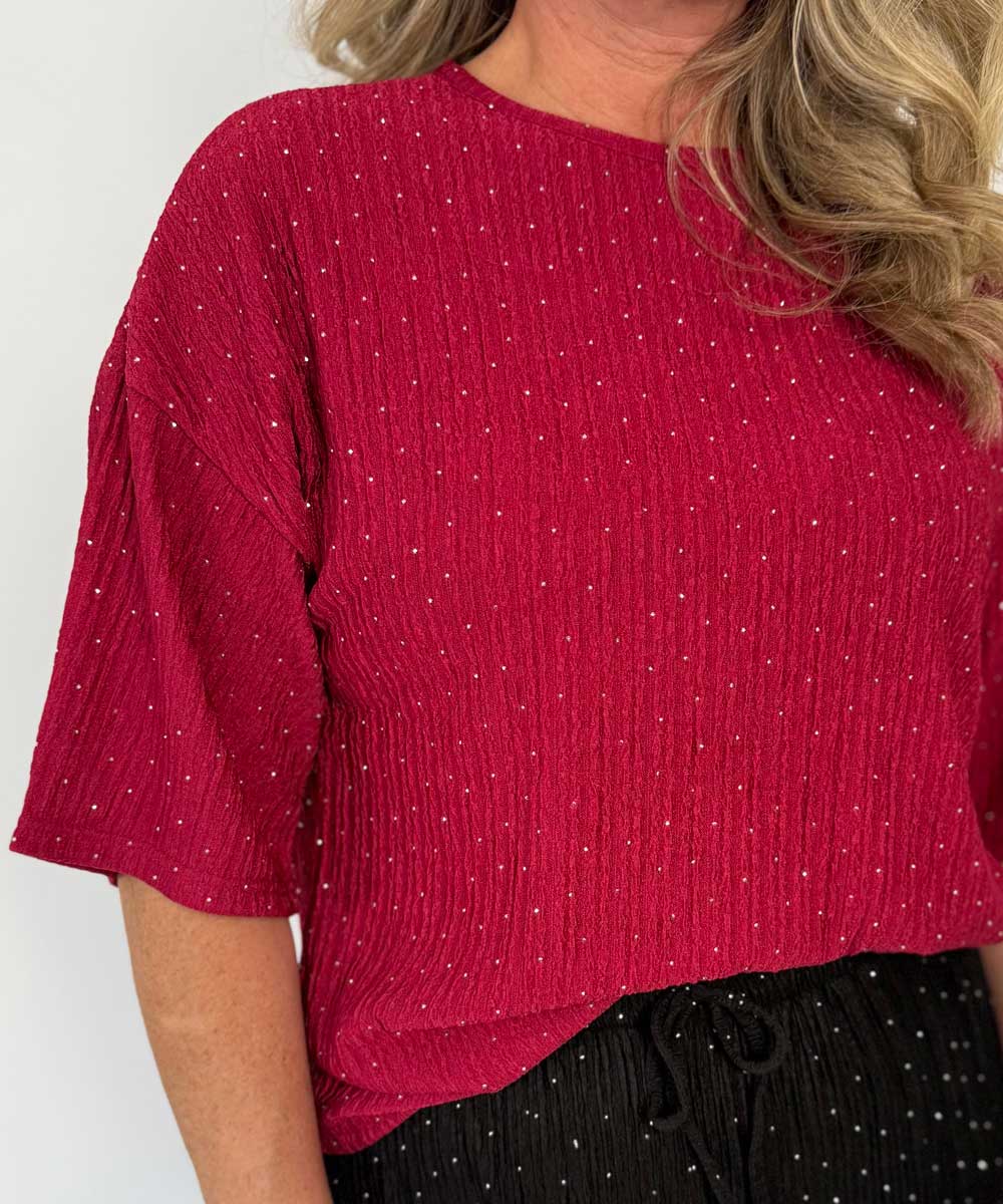 detaljer röd glittrig topp