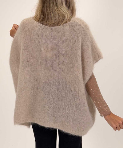 beige väst baksida