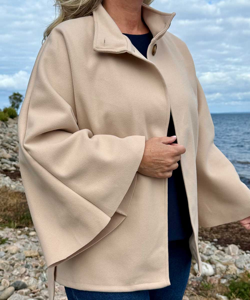 detaljer beige jacka