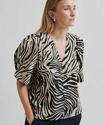 blus med beige/svart mönster