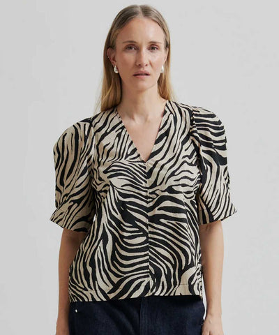 Blus med zebramönster