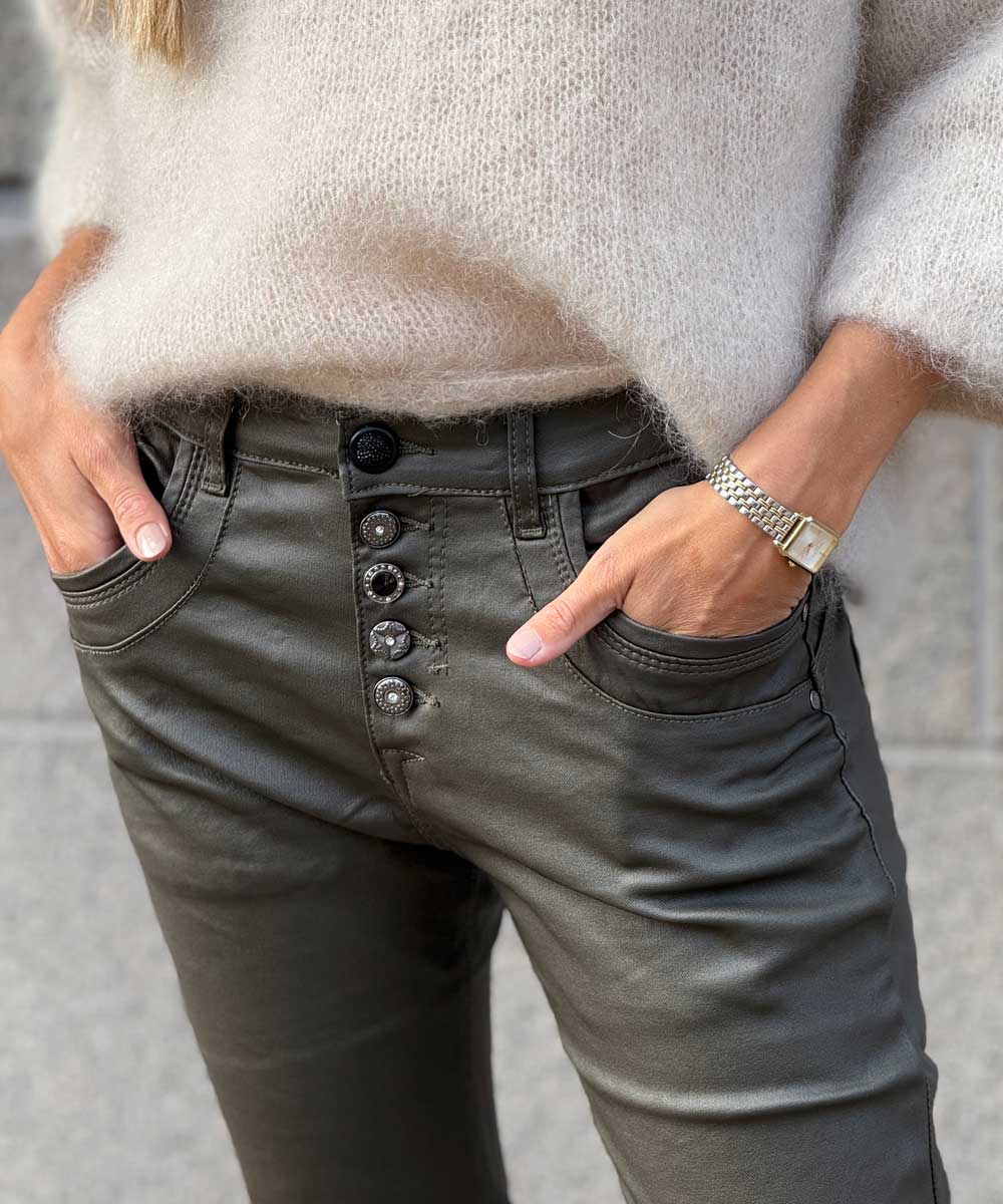 detaljer grön byxa