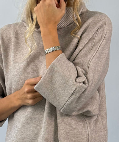 Beige polo med knapp