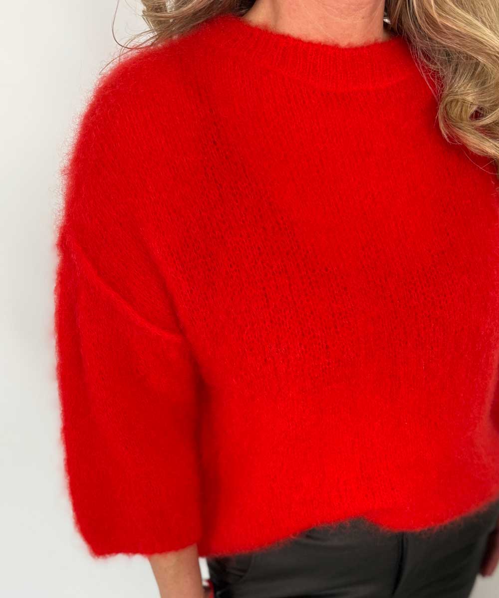 detaljer röd stickad mohair